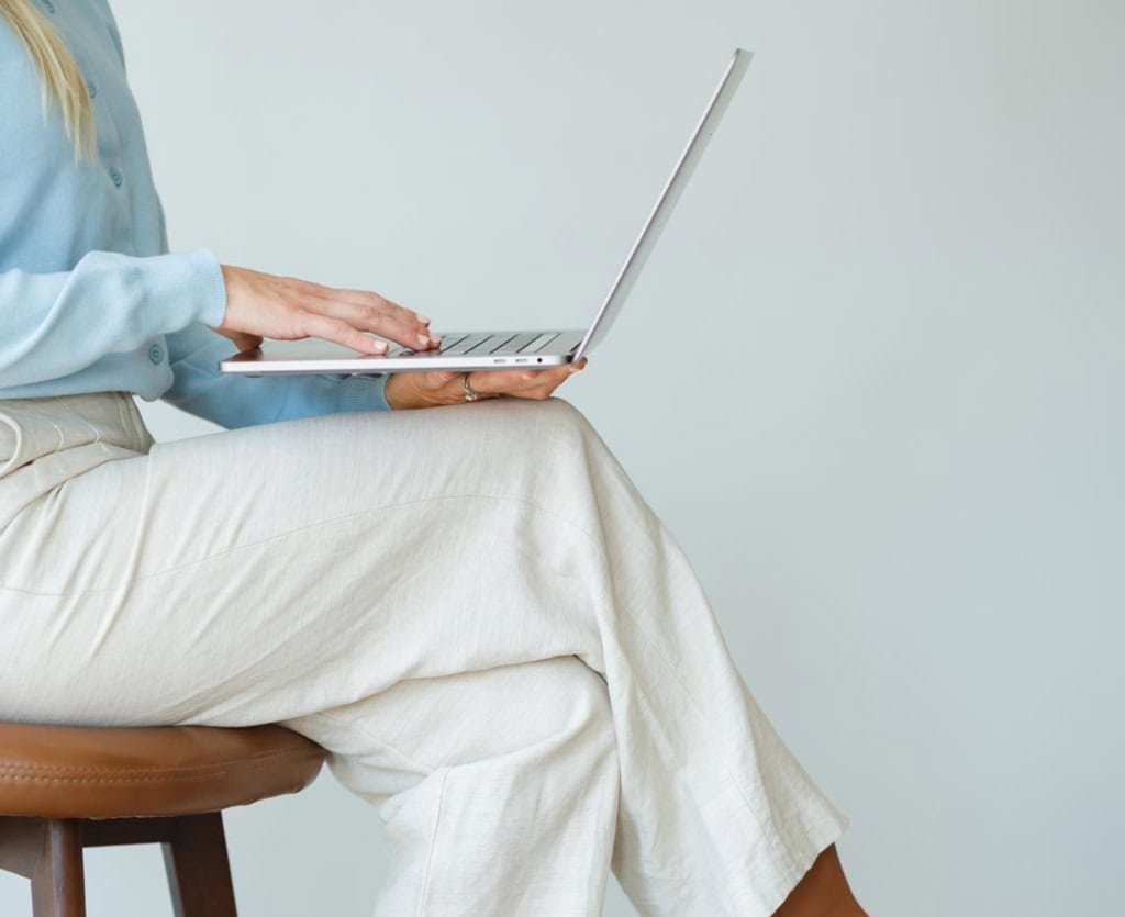 Close up of laptop with Ricki-Lee Jewell, North Pacific Homes Group, eXp Realty, in Victoria, BC.